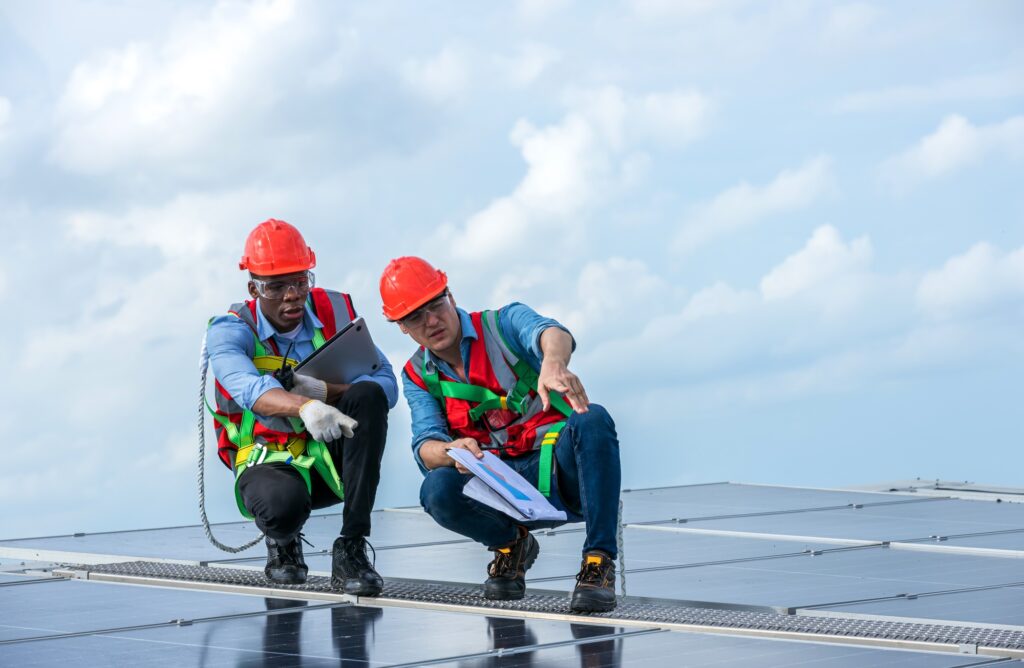 Engineer working setup Solar panel at the roof top. Engineer or worker work on solar panels or solar