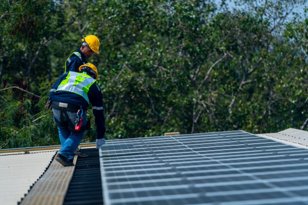 team of professionals installs solar panels